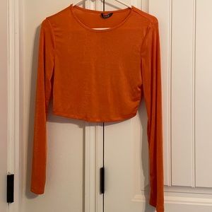 An orange crop top